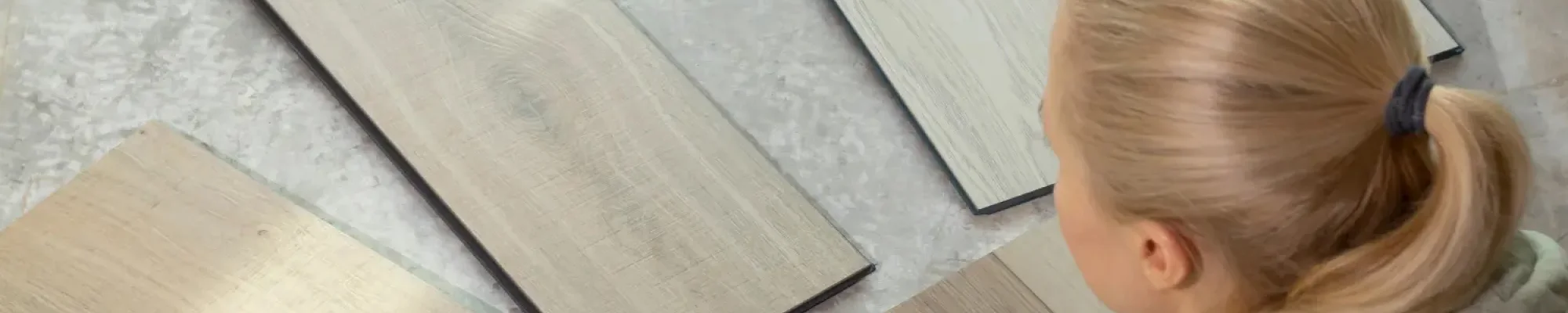 Homeowner looking at eco-friendly flooring samples